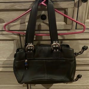 New Wilson’s leather black purse. Size 12.5” long and 9” high.